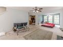 Open living area with kitchen view and a ceiling fan at 5439 Village Rdg, Fairburn, GA 30213