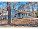 Newly painted light blue house with a spacious front yard at 2080 Bluffton Way, Decatur, GA 30035