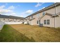 Large backyard with grassy area and view of neighboring townhomes at 45 Eagle Glen Ne Dr, Cartersville, GA 30121