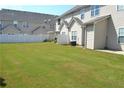 Spacious grassy backyard with a white privacy fence at 45 Eagle Glen Ne Dr, Cartersville, GA 30121