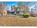 House with a large front yard and mature trees at 2142 Cloverdale Se Dr, Atlanta, GA 30316