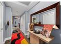 Bright hallway with decorative rug and modern console table at 285 Centennial Olympic Park Nw Dr # 401, Atlanta, GA 30313