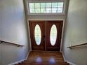 Elegant interior entryway with double doors and hardwood floors at 5005 Dublin Dr, South Fulton, GA 30331