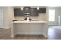 Large kitchen island with white countertop and gray cabinets at 756 Vireo Walk, Loganville, GA 30052