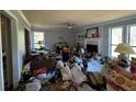 Living room with fireplace and lots of clutter at 3152 Normandy Ne Cir, Marietta, GA 30062