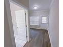 Spacious bedroom with wood floors and exterior access at 2005 Ocean Nw Dr, Atlanta, GA 30318