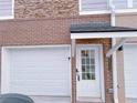 Attached garage with private entrance and brick facade at 2005 Ocean Nw Dr, Atlanta, GA 30318