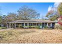 Ranch style home with a large front yard and mature trees at 208 Ridgeland Ave, Decatur, GA 30030