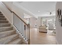 Elegant carpeted staircase with black metal balusters at 523 Lanier Way, Temple, GA 30179