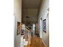 Two-story foyer with hardwood floors and staircase at 8228 River Pointe Overlook, Winston, GA 30187