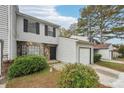 Townhome exterior with stone accents and landscaping at 703 Pine Tree Trl, Atlanta, GA 30349