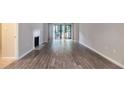 Spacious living room featuring hardwood floors and fireplace at 2101 Pine Heights Ne Dr, Atlanta, GA 30324