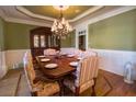 Formal dining room with hardwood floors, chandelier, and built-in hutch at 3032 Canton View Walk, Marietta, GA 30068