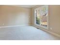 Bright bedroom with neutral walls and carpeting at 5184 Dovecote Trl, Suwanee, GA 30024