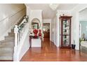 Bright entryway with hardwood floors, staircase, and decorative accents at 3547 Valley Bluff Ln, Snellville, GA 30039