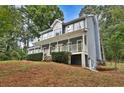 A charming two-story home nestled on a hillside at 1230 Scenic Brook Sw Trl, Conyers, GA 30094