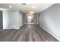 Spacious living room with grey walls and wood-look flooring at 1337 Muirforest Dr, Stone Mountain, GA 30088
