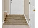 Home entry with wood-look flooring and neutral walls at 2213 Asquith Sw Ave, Marietta, GA 30008