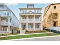 Two-story home with brick facade, front porch and landscaping at 4004 Moody Ln, Woodstock, GA 30188