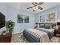 Bright bedroom with hardwood floors and ceiling fan at 111 Charles Pl, Cumming, GA 30040