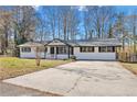 Newly renovated ranch home with a large driveway at 111 Charles Pl, Cumming, GA 30040