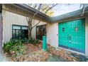 Teal double front doors and a landscaped entryway at 1845 Branch Valley Dr, Roswell, GA 30076