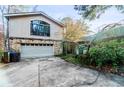 View of the house's garage and partial exterior at 1845 Branch Valley Dr, Roswell, GA 30076