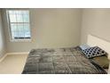 Cozy bedroom with plush bedding and a large window at 1005 Chastain Park Ne Ct # 1005, Atlanta, GA 30342