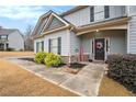 Inviting front walkway leading to the entrance of a two-story home at 46 Foothills Ne Pkwy, Rydal, GA 30171