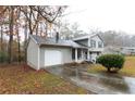 Front view of the house, showing the garage and driveway at 1841 Northwick Pl, Lithonia, GA 30058
