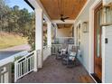 Inviting front porch with rocking chairs, perfect for relaxing at 1130 Lupo Loop, Chattahoochee Hills, GA 30268