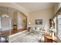 Spacious living room featuring hardwood floors and a large window at 240 Bristolstone Ct, Alpharetta, GA 30005