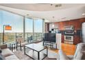 Open-concept living space with modern kitchen, large windows, and city views at 361 17Th Nw St # 2208, Atlanta, GA 30363