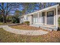 Front entry of charming Ranch home with walkway and landscaping at 2496 Montezuma Cir, Ellenwood, GA 30294