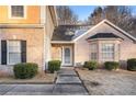 Front entrance with steps leading to the front door and landscaping at 4088 Smithfield Trl, Ellenwood, GA 30294