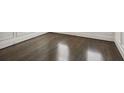 Dark-stained hardwood floors in a corner of a room at 333 Brownstones Ne Cir, Atlanta, GA 30312