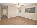 Bright living room with hardwood floors, ceiling fan, and access to backyard at 2671 Tilson Rd, Decatur, GA 30032