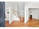 Bright entryway with hardwood floors, staircase, and views to the living room and Gathering room at 2849 Weston Brook Ln, Duluth, GA 30096