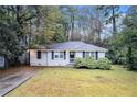 Ranch style home with a spacious yard and tree-lined street at 2791 Mcafee Rd, Decatur, GA 30032