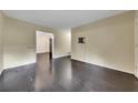 Spacious living room with dark hardwood floors at 125 W South St, Canton, GA 30114