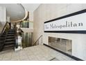 Building lobby with escalator and The Metropolitan sign at 20 Marietta Nw St # 4D, Atlanta, GA 30303