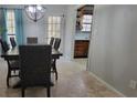 Charming dining room with a rustic table and access to kitchen at 5479 Dorsett Shoals Rd, Douglasville, GA 30135