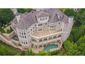 Luxury home with pool and expansive patio, offering stunning views at 1055 Leadenhall St, Alpharetta, GA 30022