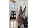 Elegant entryway with a grand staircase and a large Christmas tree at 1055 Leadenhall St, Alpharetta, GA 30022