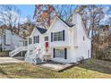 Two-story white house with a red front door and stairs at 3563 Stratford, Douglasville, GA 30135