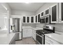 Modern kitchen with stainless steel appliances and white cabinets at 5667 Cascade Sw Run, Atlanta, GA 30336