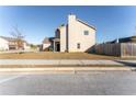 Side view of the house showcasing its siding and backyard at 4207 Franklin Mill Ln, Loganville, GA 30052