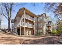 Back view of multi-unit condo building nestled among trees at 906 Country Park Se Dr, Smyrna, GA 30080