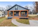 Gray craftsman style home with a wrap around porch at 715 N Evelyn Nw Pl, Atlanta, GA 30318