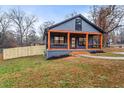 Gray craftsman style home with a wrap around porch at 715 N Evelyn Nw Pl, Atlanta, GA 30318